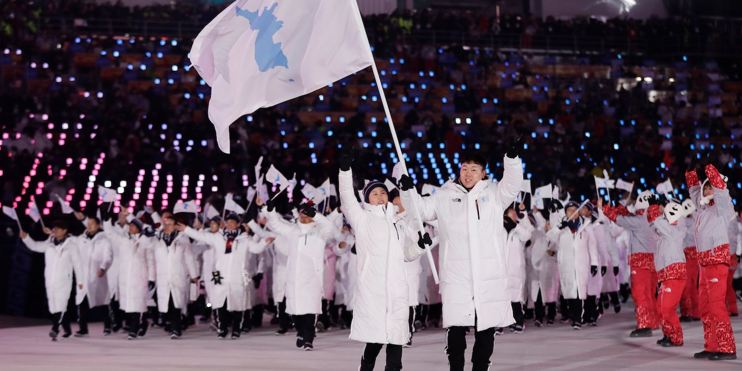 Koreans holding the flag